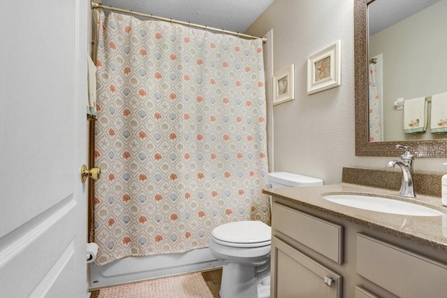full bathroom featuring toilet, vanity, a textured ceiling, and shower / bathtub combination with curtain