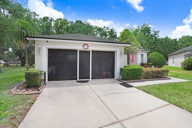 ranch-style home featuring a front yard, stucco siding, and concrete driveway