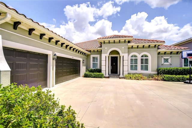5728 Watercolor Dr, Lithia, FL 33547 - mediterranean / spanish home featuring a tile roof, concrete driveway, and stucco siding