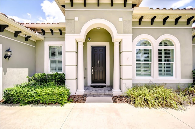 5728 Watercolor Dr, Lithia, FL 33547 - doorway to property featuring stucco siding