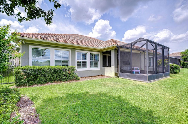 5728 Watercolor Dr, Lithia, FL 33547 - rear view of property with a tiled roof and stucco siding