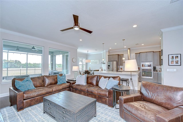 5728 Watercolor Dr, Lithia, FL 33547 - living area featuring ceiling fan, crown molding, light wood-type flooring, recessed lighting, and baseboards