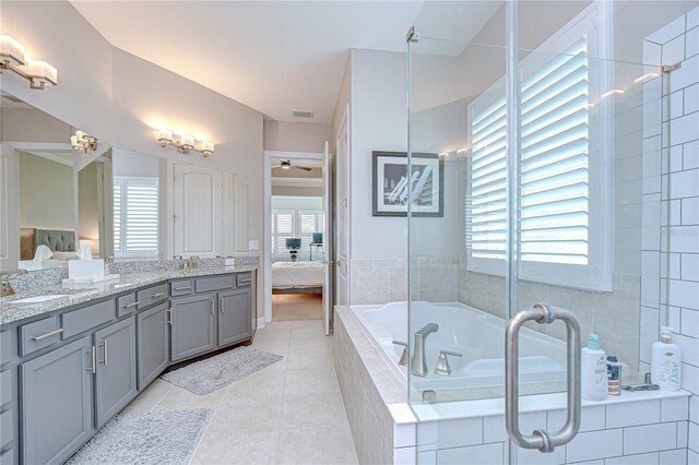 5728 Watercolor Dr, Lithia, FL 33547 - bathroom with connected bathroom, healthy amount of natural light, and double vanity