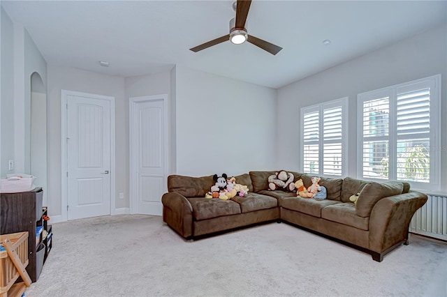 5728 Watercolor Dr, Lithia, FL 33547 - living room featuring ceiling fan, carpet floors, and radiator
