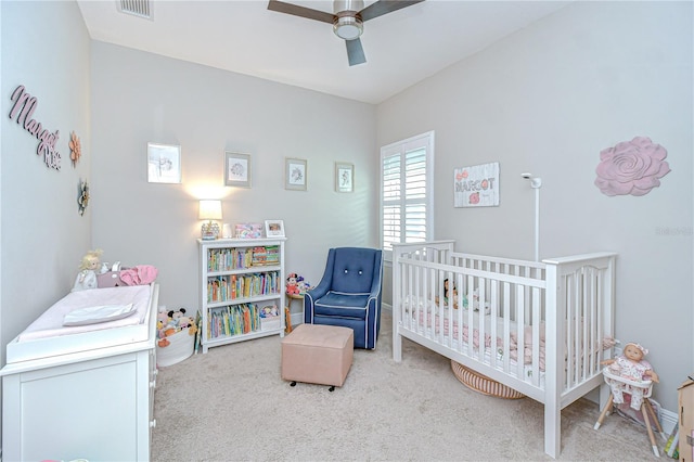 5728 Watercolor Dr, Lithia, FL 33547 - bedroom with carpet flooring, a crib, and ceiling fan