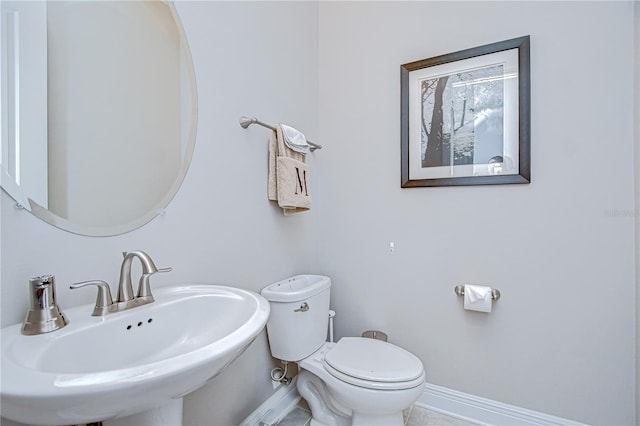 5728 Watercolor Dr, Lithia, FL 33547 - bathroom featuring a sink, baseboards, and toilet