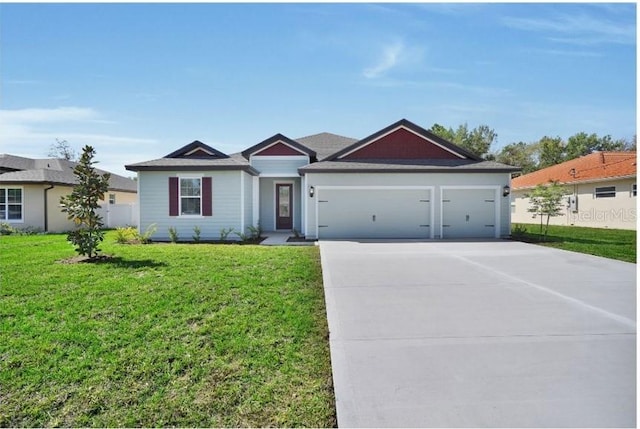 2649 SW 176th Loop, Ocala, FL 34473 - single story home featuring driveway, a garage, and a front yard