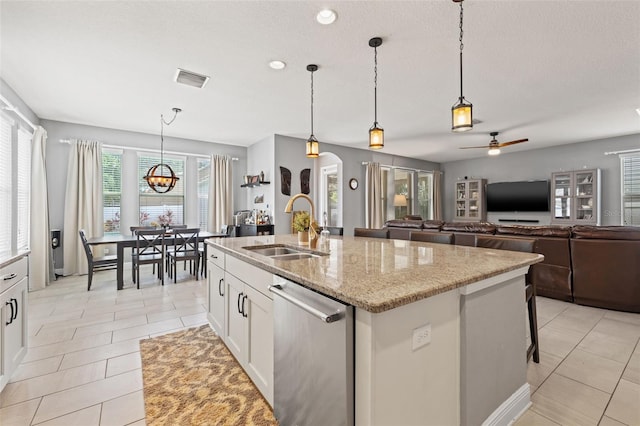 1436 30th Ave N, Saint Petersburg, FL 33704 - kitchen with a sink, dishwasher, light tile patterned flooring, arched walkways, and recessed lighting