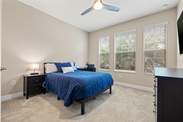 1436 30th Ave N, Saint Petersburg, FL 33704 - bedroom with baseboards, light colored carpet, and ceiling fan