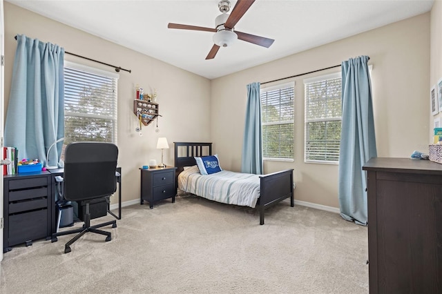 1436 30th Ave N, Saint Petersburg, FL 33704 - bedroom featuring light colored carpet, baseboards, ceiling fan, and a desk