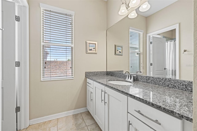 1436 30th Ave N, Saint Petersburg, FL 33704 - full bathroom with baseboards, plenty of natural light, vanity, and a chandelier