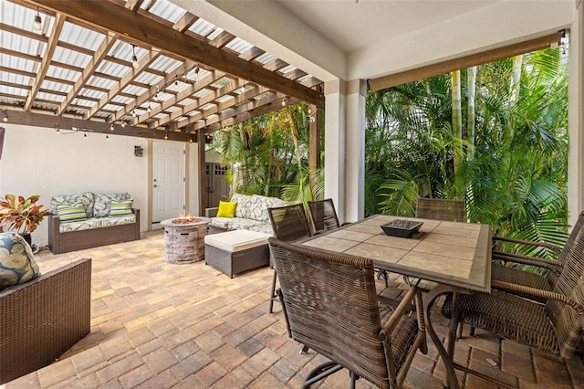 1436 30th Ave N, Saint Petersburg, FL 33704 - view of patio / terrace featuring a pergola, an outdoor living space with a fire pit, and outdoor dining space