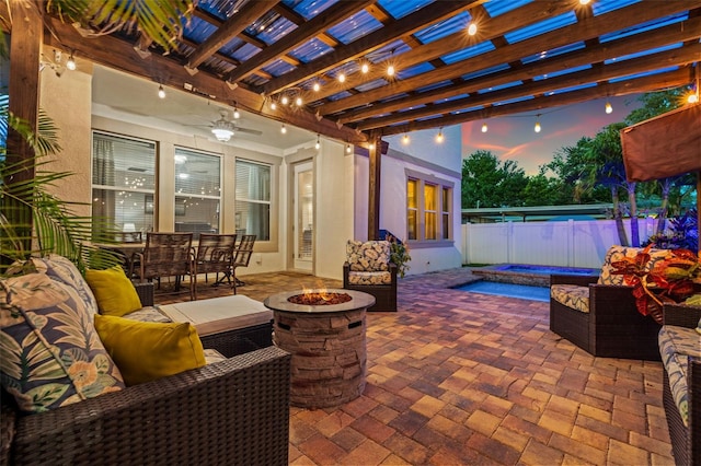 1436 30th Ave N, Saint Petersburg, FL 33704 - view of patio / terrace featuring an in-ground hot tub, an outdoor living space with a fire pit, and fence