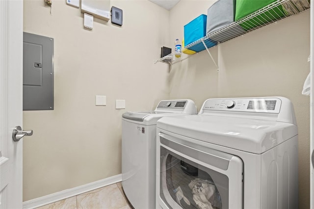 1436 30th Ave N, Saint Petersburg, FL 33704 - washroom featuring electric panel, washing machine and clothes dryer, baseboards, and light tile patterned floors