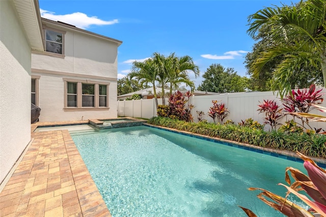 1436 30th Ave N, Saint Petersburg, FL 33704 - view of swimming pool featuring a fenced backyard and a pool with connected hot tub