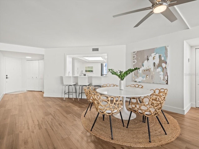 5700 Escondida Blvd S Unit 401, Saint Petersburg, FL 33715 - dining area featuring light wood-style flooring, baseboards, and a ceiling fan