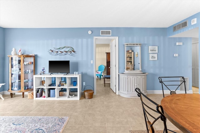 4900 Brittany Dr S Unit 209, Saint Petersburg, FL 33715 - living area featuring tile patterned floors and baseboards