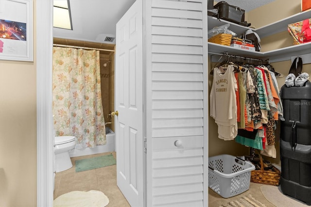 4900 Brittany Dr S Unit 209, Saint Petersburg, FL 33715 - spacious closet featuring tile patterned flooring
