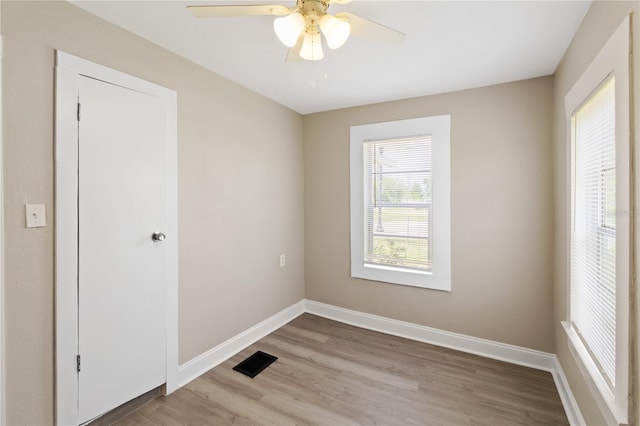 1101 Dr Martin L King Jr Way, Haines City, FL 33844 - spare room with light wood finished floors, baseboards, and a ceiling fan