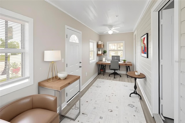 1101 Dr Martin L King Jr Way, Haines City, FL 33844 - home office featuring ornamental molding, a ceiling fan, light wood finished floors, and baseboards