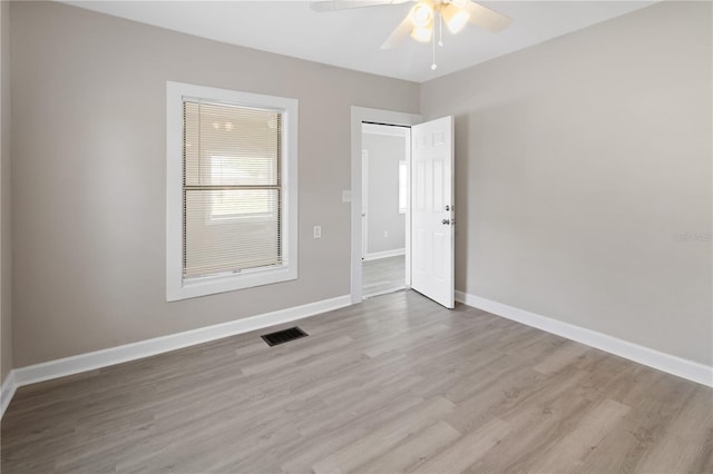 1101 Dr Martin L King Jr Way, Haines City, FL 33844 - spare room featuring ceiling fan, light wood-style flooring, and baseboards