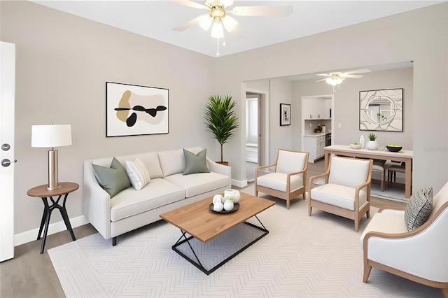 1101 Dr Martin L King Jr Way, Haines City, FL 33844 - living area featuring ceiling fan, light wood-style floors, and baseboards