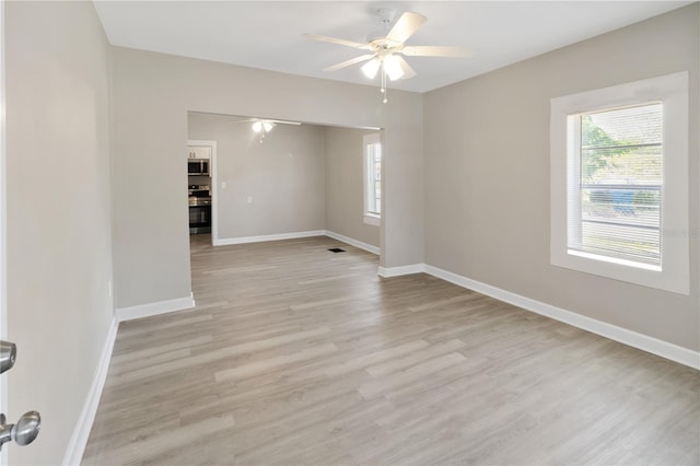 1101 Dr Martin L King Jr Way, Haines City, FL 33844 - empty room with ceiling fan, light wood-style flooring, and baseboards