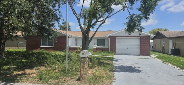6105 Westport Dr, Port Richey, FL 34668 - ranch-style house with brick siding, an attached garage, and concrete driveway