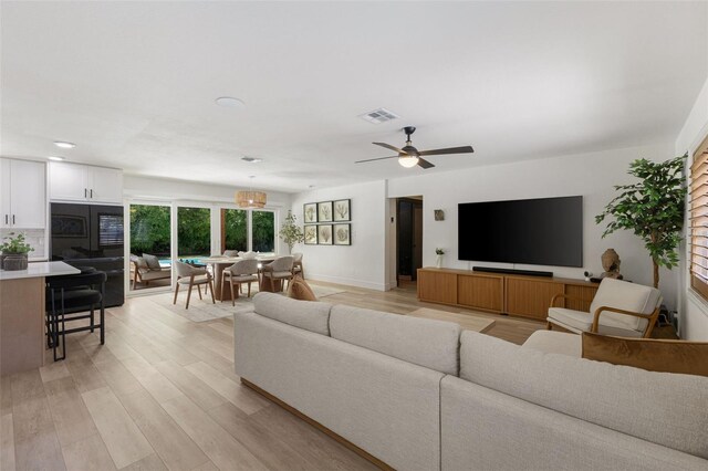 4618 Bayshore Blvd NE, Saint Petersburg, FL 33703 - living room with light wood-style flooring, a ceiling fan, and recessed lighting