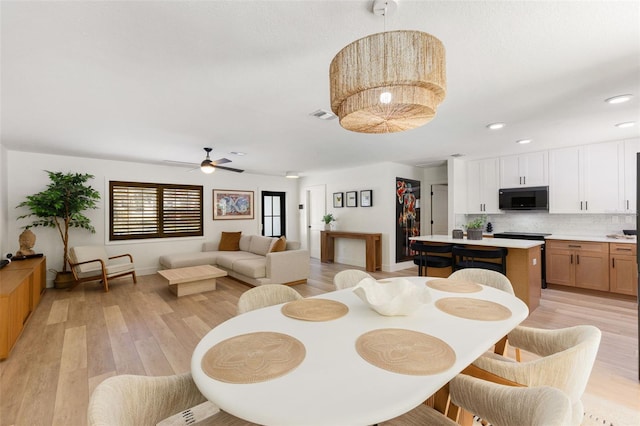 4618 Bayshore Blvd NE, Saint Petersburg, FL 33703 - dining space with light wood finished floors, recessed lighting, a ceiling fan, and baseboards