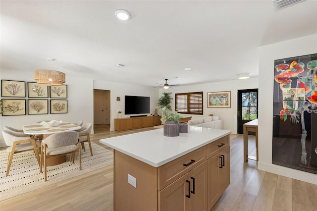 4618 Bayshore Blvd NE, Saint Petersburg, FL 33703 - kitchen featuring light wood-style flooring, ceiling fan, light countertops, a center island, and recessed lighting