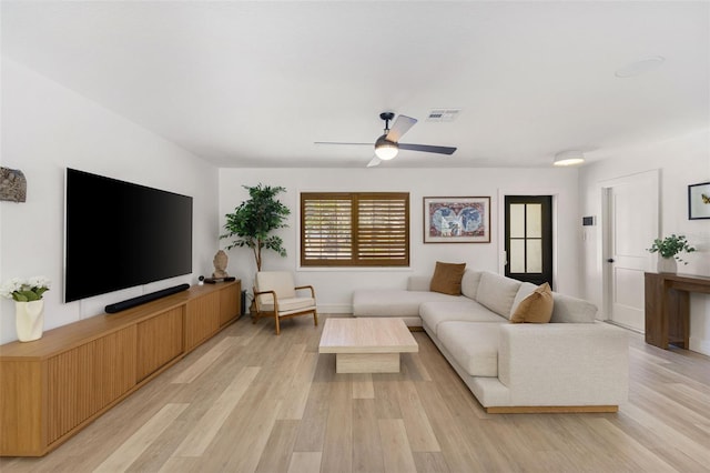 4618 Bayshore Blvd NE, Saint Petersburg, FL 33703 - living room with light wood finished floors, ceiling fan, and baseboards