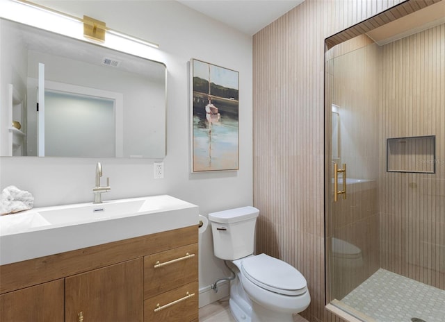 4618 Bayshore Blvd NE, Saint Petersburg, FL 33703 - bathroom featuring toilet, a stall shower, and vanity