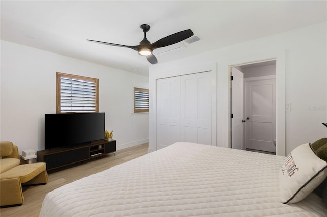 4618 Bayshore Blvd NE, Saint Petersburg, FL 33703 - bedroom featuring light wood-style flooring, a closet, ceiling fan, and baseboards