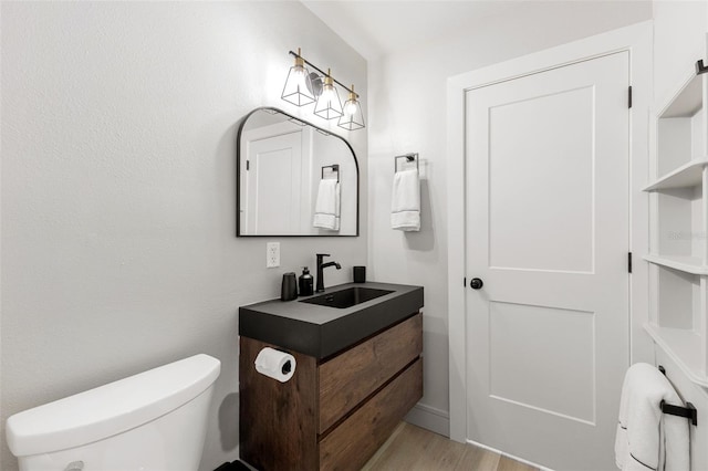 4618 Bayshore Blvd NE, Saint Petersburg, FL 33703 - bathroom featuring toilet, wood finished floors, and vanity