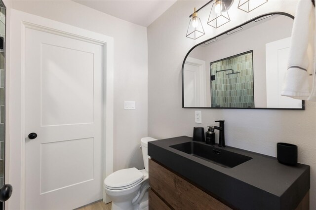 4618 Bayshore Blvd NE, Saint Petersburg, FL 33703 - bathroom featuring toilet, vanity, and a tile shower