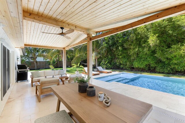 4618 Bayshore Blvd NE, Saint Petersburg, FL 33703 - view of swimming pool featuring a fenced backyard, a patio area, area for grilling, a ceiling fan, and an outdoor hangout area