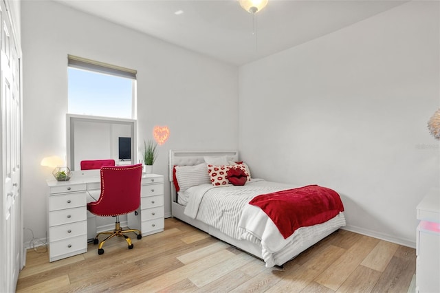 bedroom with wood finished floors