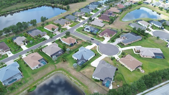 view of property location featuring nearby suburban area and a nearby body of water