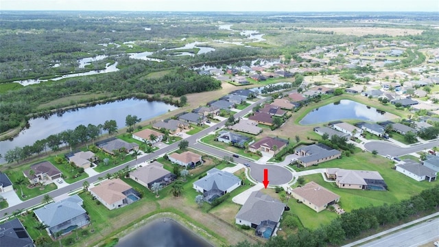view of property location with a large body of water and nearby suburban area