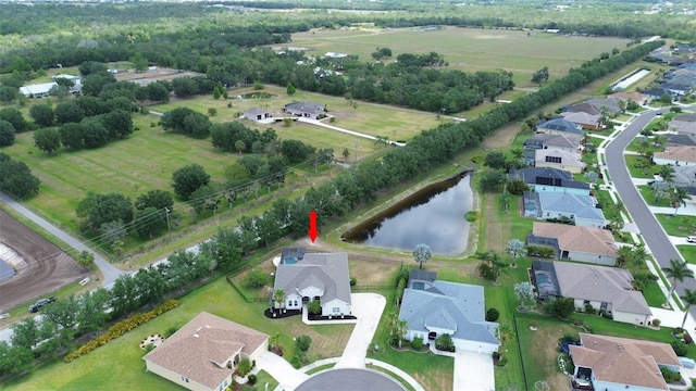 view of property location featuring nearby suburban area and a nearby body of water