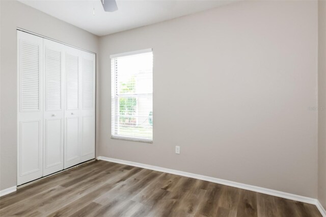 408 S Edgemon Ave, Winter Springs, FL 32708 - unfurnished bedroom with wood finished floors, baseboards, a closet, and ceiling fan