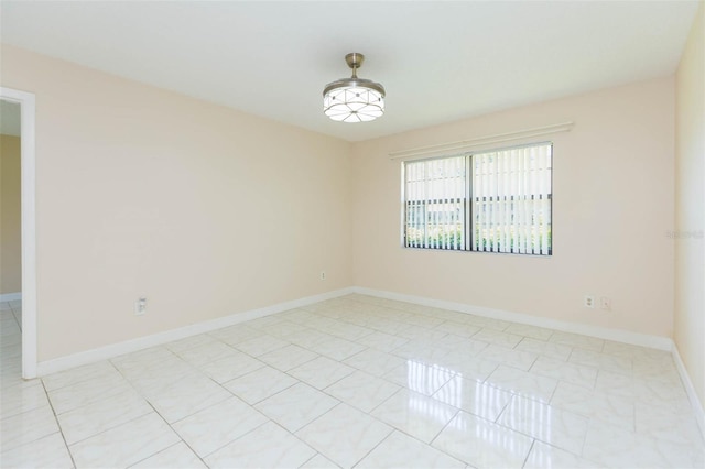 2211 Bay Berry Ln, Clearwater, FL 33763 - unfurnished room featuring baseboards and light tile patterned floors
