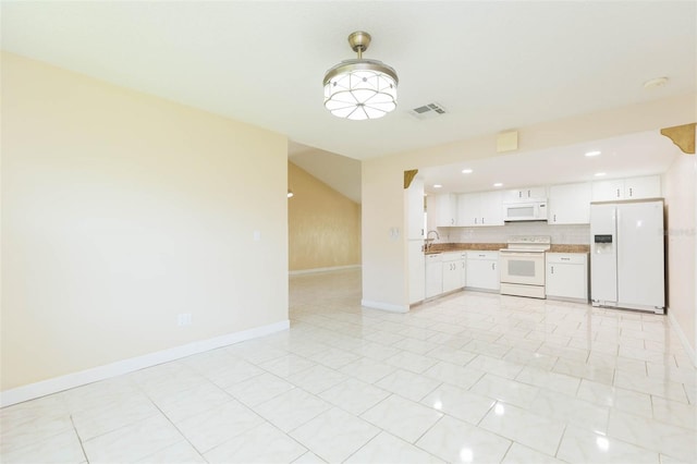 2211 Bay Berry Ln, Clearwater, FL 33763 - kitchen featuring white appliances, baseboards, a sink, white cabinetry, and open floor plan