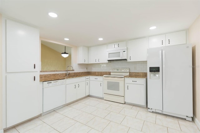 2211 Bay Berry Ln, Clearwater, FL 33763 - kitchen featuring white appliances, a sink, white cabinets, and recessed lighting