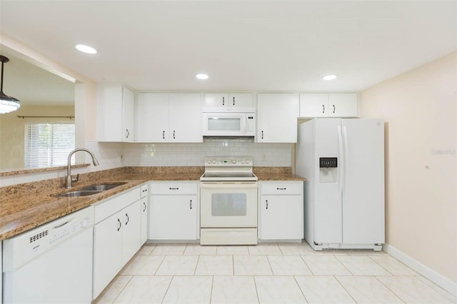 2211 Bay Berry Ln, Clearwater, FL 33763 - kitchen featuring white appliances, a sink, white cabinetry, stone countertops, and recessed lighting