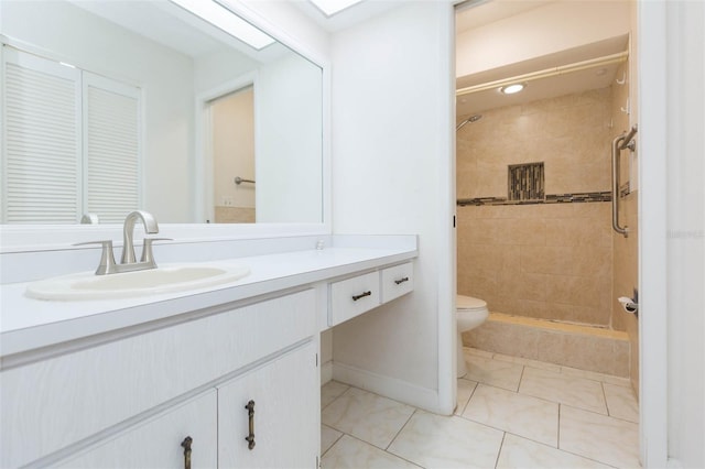 2211 Bay Berry Ln, Clearwater, FL 33763 - full bathroom with toilet, vanity, a tile shower, tile patterned flooring, and baseboards