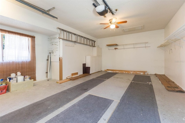 2211 Bay Berry Ln, Clearwater, FL 33763 - garage with ceiling fan and a garage door opener