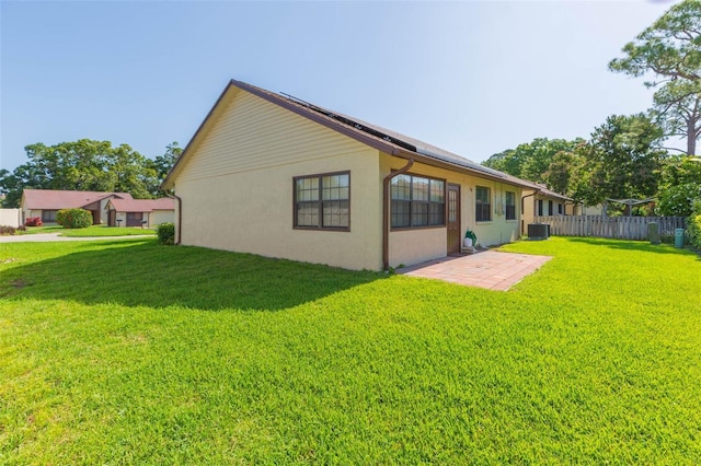 2211 Bay Berry Ln, Clearwater, FL 33763 - back of property featuring a patio, central AC unit, and stucco siding