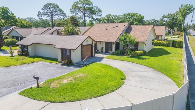 2211 Bay Berry Ln, Clearwater, FL 33763 - ranch-style home with driveway, a garage, a shingled roof, and a residential view
